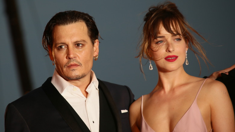 Johnny Depp and Dakota Johnson posing together