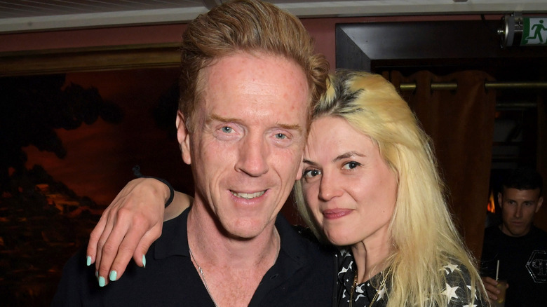 Damian Lewis and Alison Mosshart posing