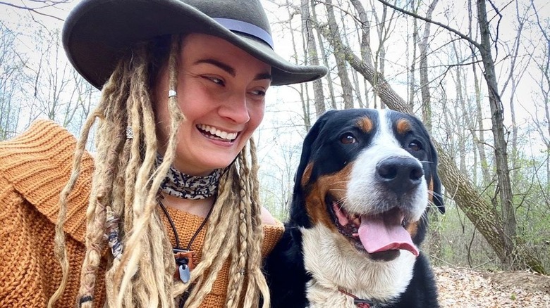 Naked and Afraid's Dani Beau smiling with dog