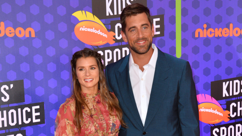 Danica Patrick, Aaron Rodgers, posing