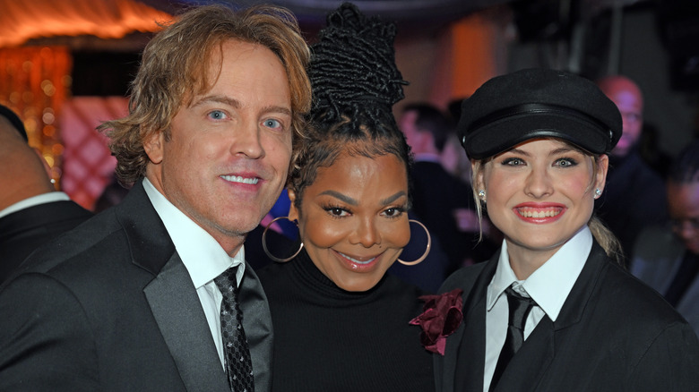 Dannielynn Birkhead posing with Larry Birkhead and Janet Jackson