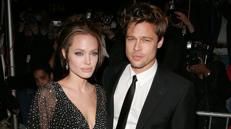 Angelina Jolie and Brad Pitt posing in 2006