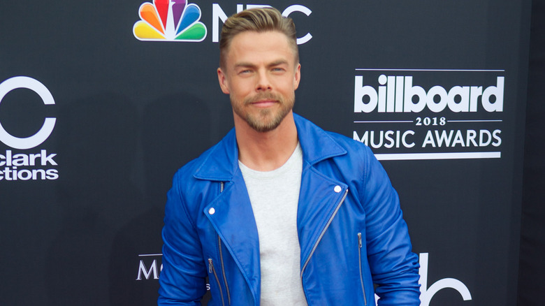 Derek Hough wearing blue coat