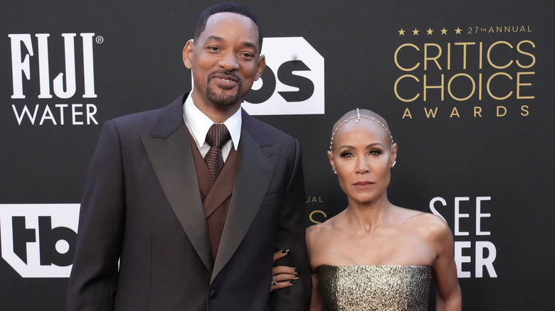 Jada Pinkett Smith and Will Smith posing on the red carpet