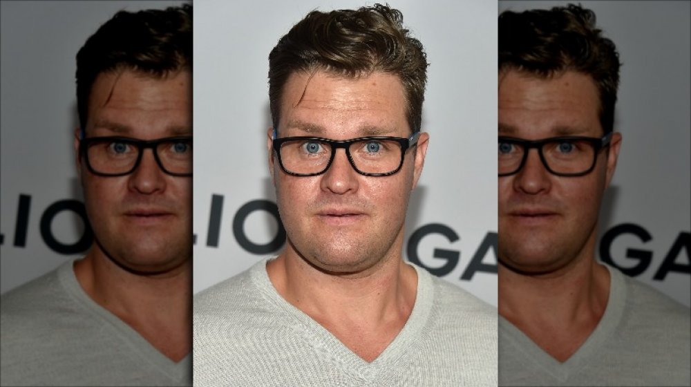 Zachery Ty Bryan wearing glasses and looking surprised