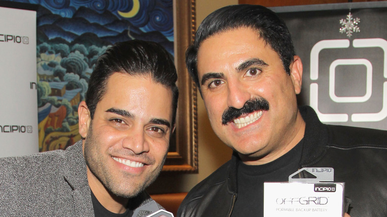 Reza Farahan smiling with Mike Shouhed