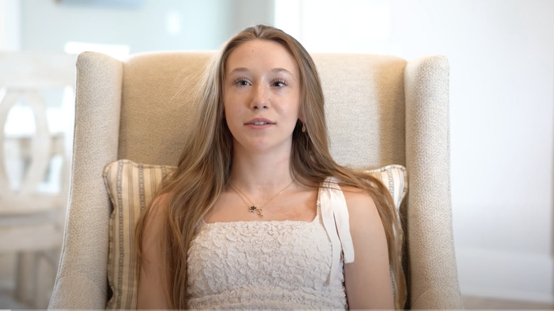 Gracie Solomon sitting in chair