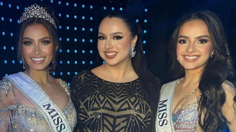 Pageant contestants huddling