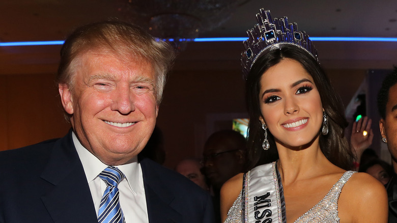 Donald Trump and Paulina Vega posing