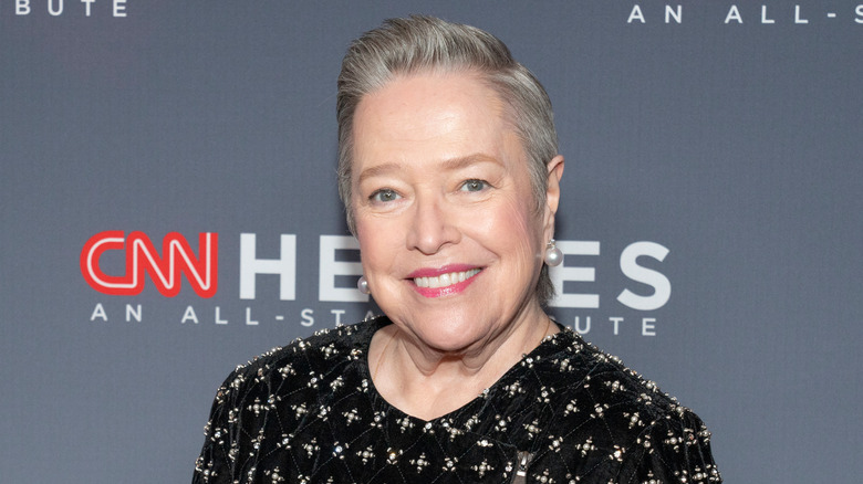 Kathy Bates smiling to the camera on the red carpet