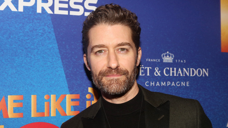 Matthew Morrison looks solemnly in to the camera