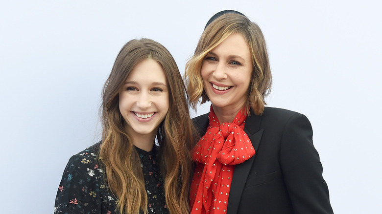 Taissa and Vera Farmiga smiling off camera on the red carpet