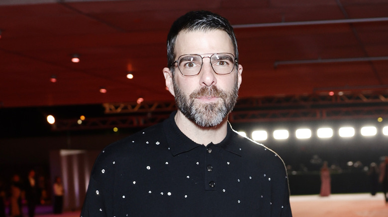 Zachary Quinto posing solemnly on the red carpet