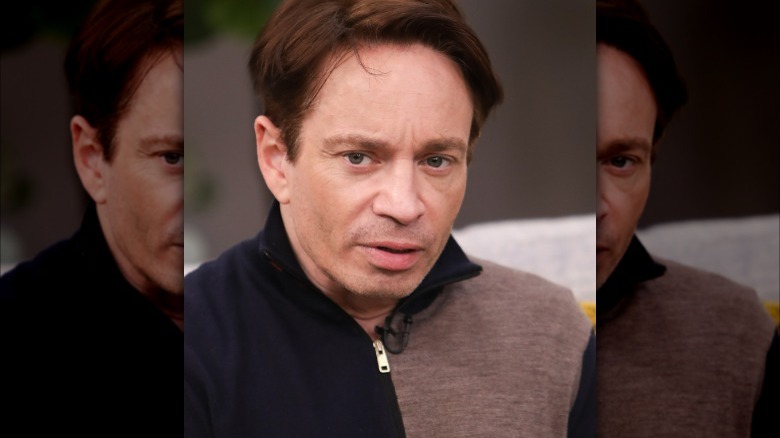 Chris Kattan posing at event