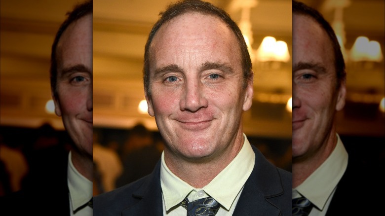 Jay Mohr smiling smug