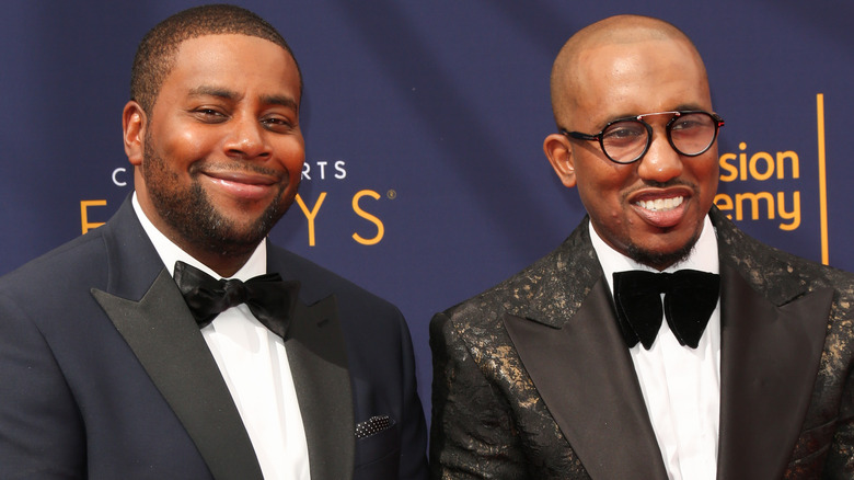 Kenan Thompson (left) and Chris Redd (right) smiling on the red carpet