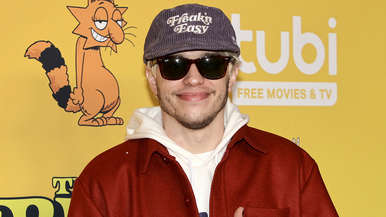 Pete Davidson in cap and sunglasses