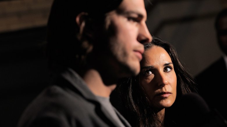 Ashton Kutcher and Demi Moore looking serious