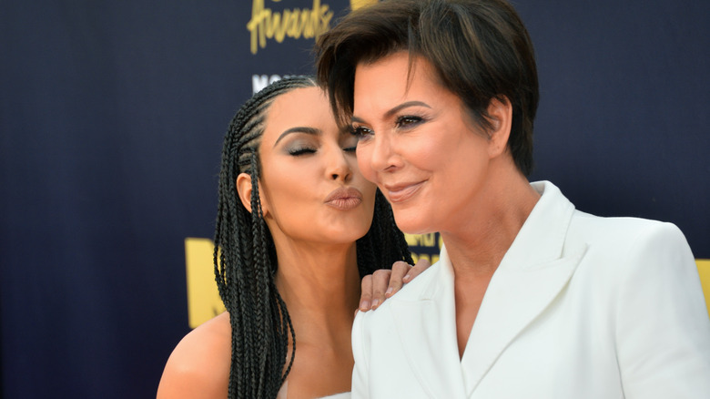 Kim Kardashian kissing Kris Jenner's cheek