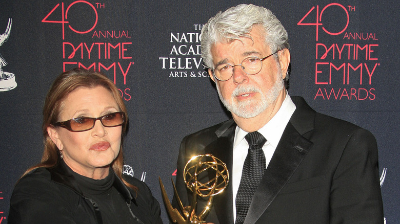 Carrie Fisher and George Lucas posing