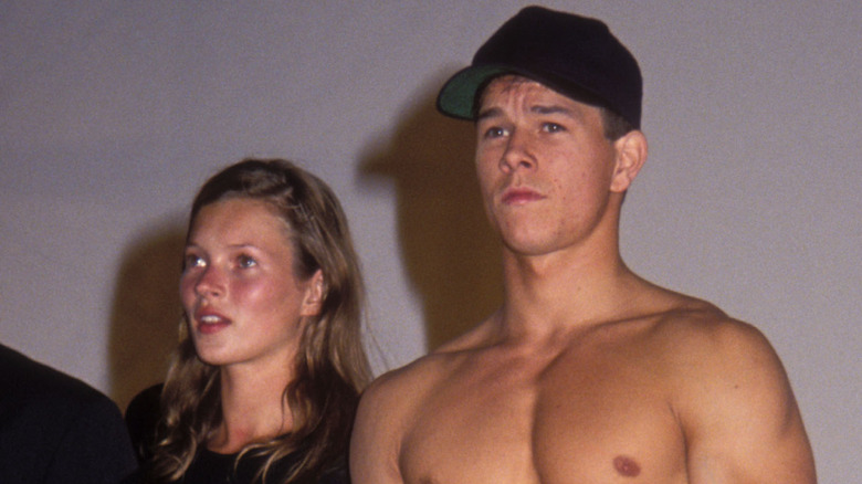 Kate Moss and Mark Wahlberg standing on stage