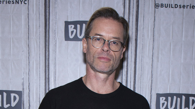 Guy Pearce in black shirt 