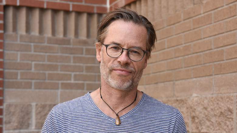 Guy Pearce in striped blue shirt 