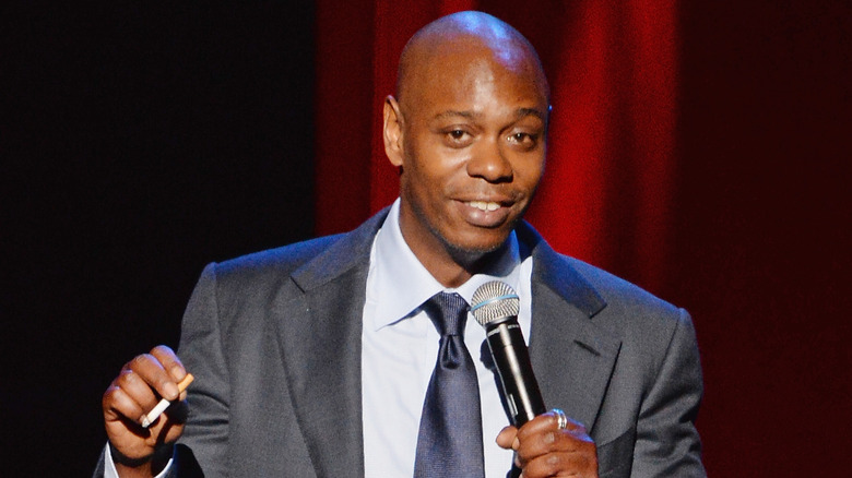 Dave Chappelle performing onstage