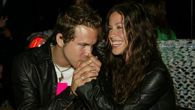 Ryan Reynolds kissing Alanis Morissette's hand