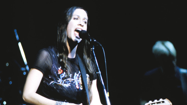 Alanis Morissette sings and plays guitar