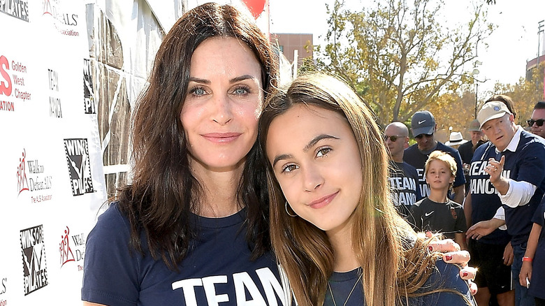 Coco Arquette poses for a photo with mom Courteney Cox