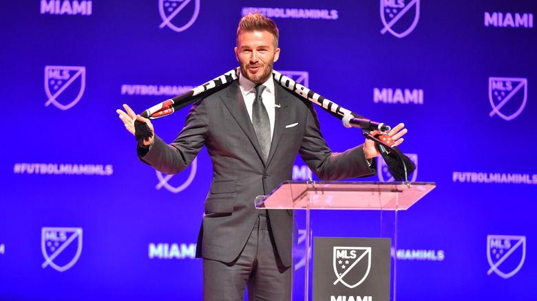 David Beckham standing at a podium