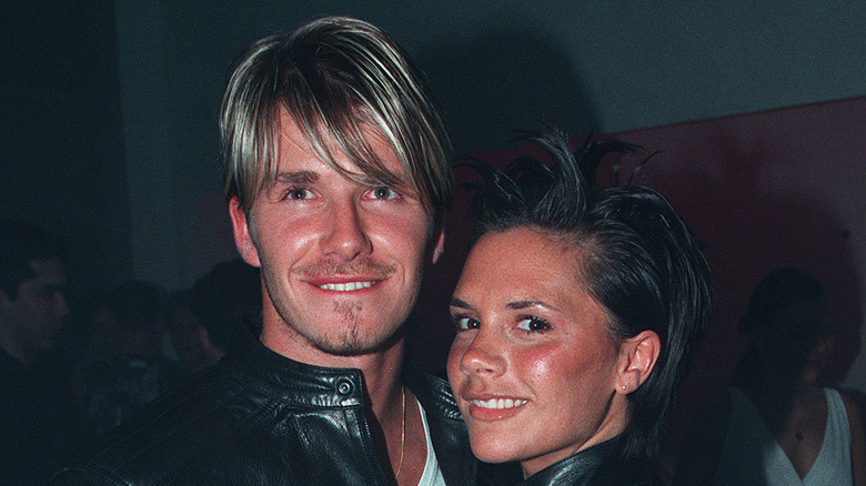 David and Victoria Beckham smiling in 1999