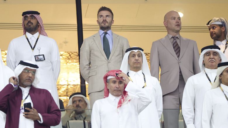 David Beckham standing at the World Cup in Qatar