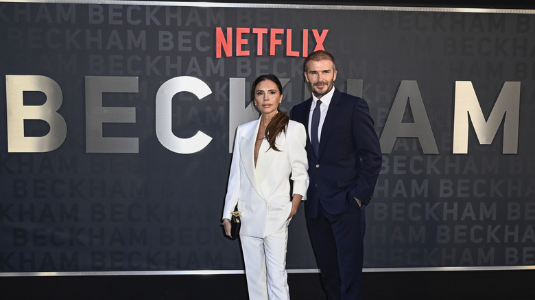 Victoria and David Beckham posing