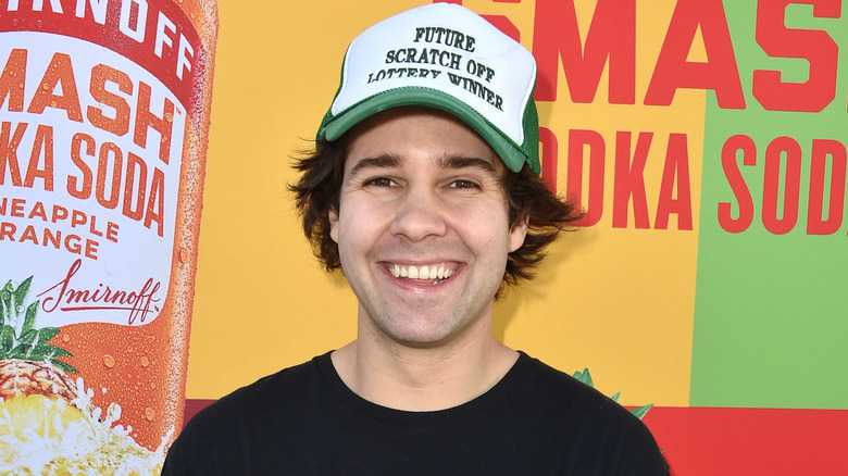 David Dobrik at a Smirnoff event wearing a hat