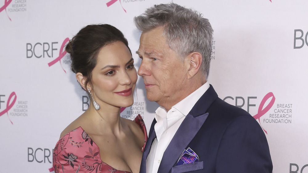 Katharine McPhee and David Foster posing at an event 