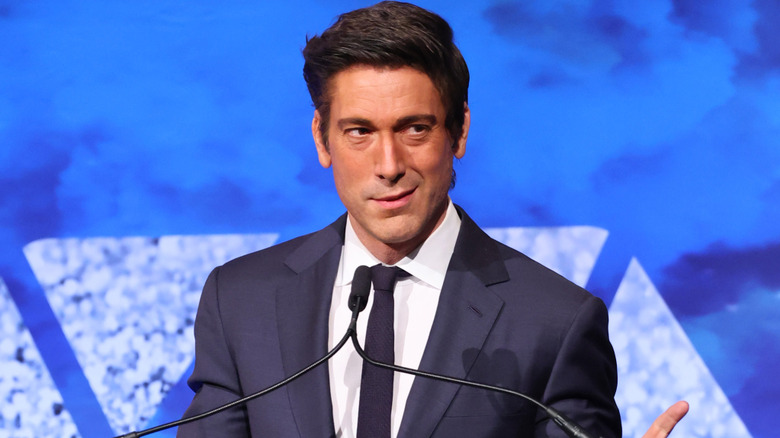 David Muir speaking at a podium