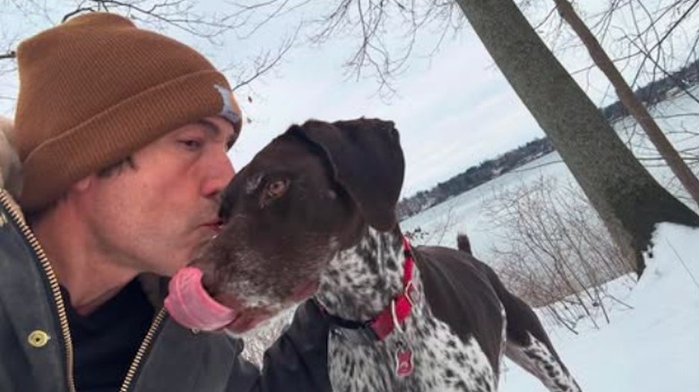 David Muir and his dog in the snow