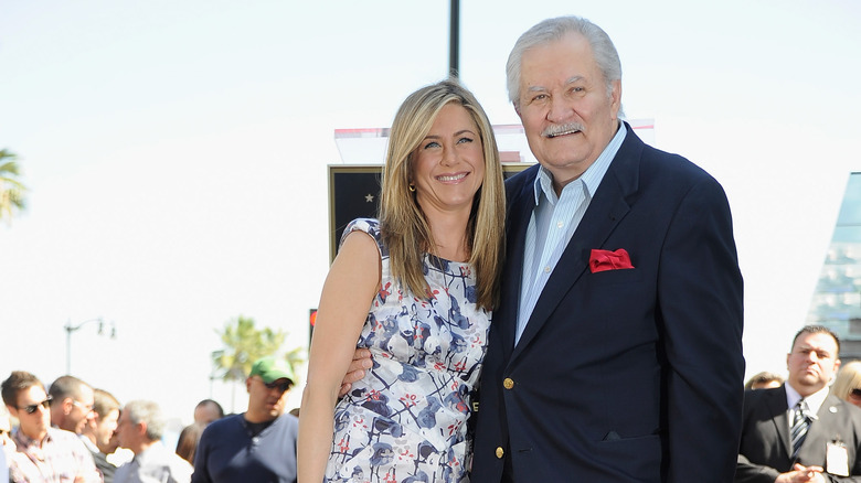 Jennifer Aniston and John Aniston posing for photo