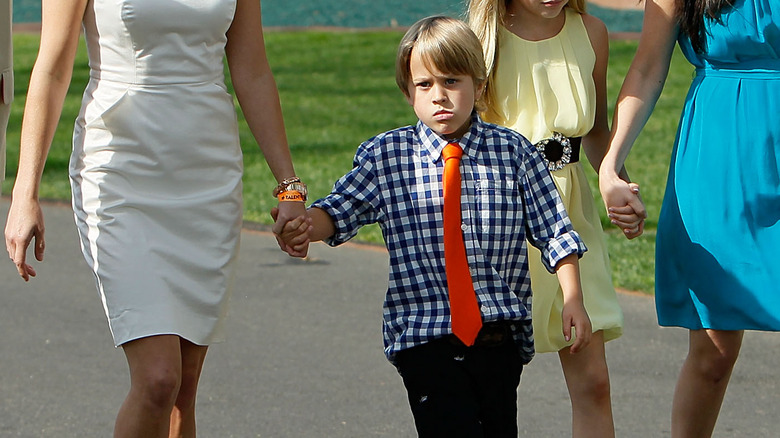 Deacon Phillippe holding Reese Witherspoon's hand