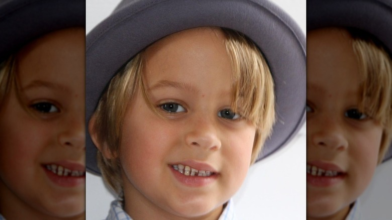 Young Deacon Phillippe wearing hat