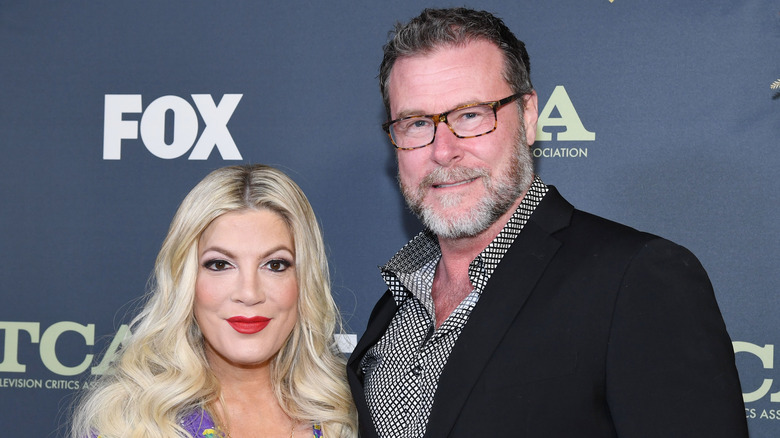 Tori Spelling red lip Dean McDermott smiling