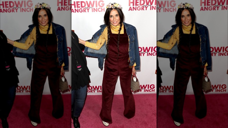 Demi Moore wearing a burgundy overalls