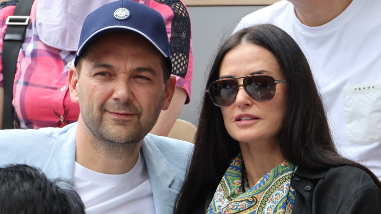 Demi Moore and Daniel Humm posing