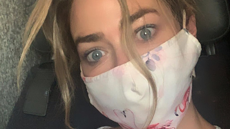 Denise Richards with a mask on