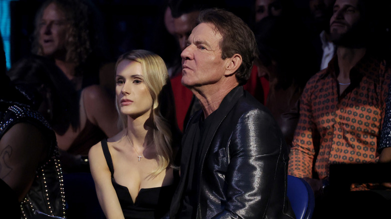 Dennis Quaid and Laura Savoie sit next to each other