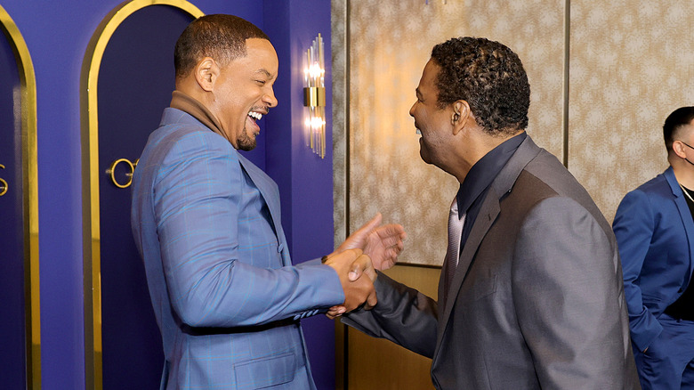 Will Smith laughing with Denzel Washington