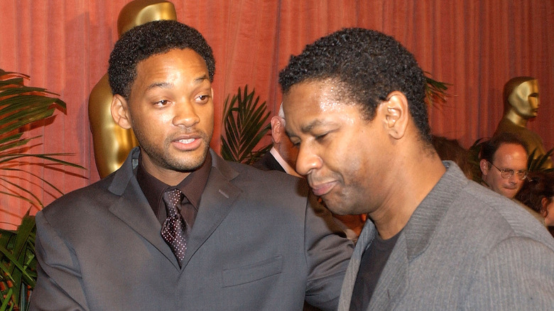 Will Smith looking at Denzel Washington