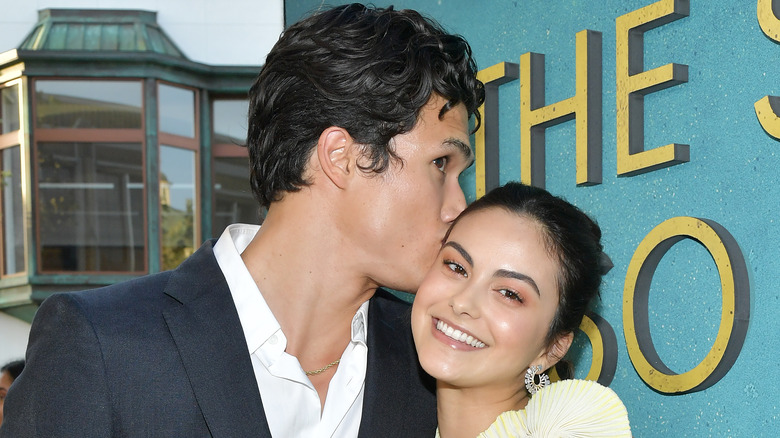 Charles Melton kissing Camila Mendes at a film premiere 